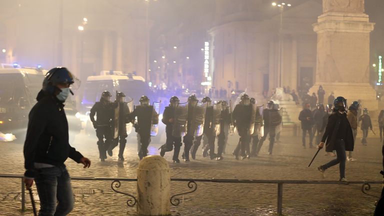 
ROME, ITALY - OCTOBER 27: Police clashed with protesters in Rome who had gathered to denounce the latest set of restrictions introduced due to the coronavirus disease (COVID-19) pandemic on October 27, 2020 in Rome, Italy. Some 200 people gathered at Piazza del Popolo and began to throw firecrackers and smoke bombs at police after they were ordered to disperse. (Photo by Elisabetta A. Villa/Getty Images)
