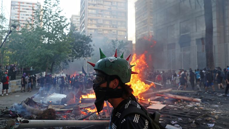 Fires burn in the background of violent protests in Chile 