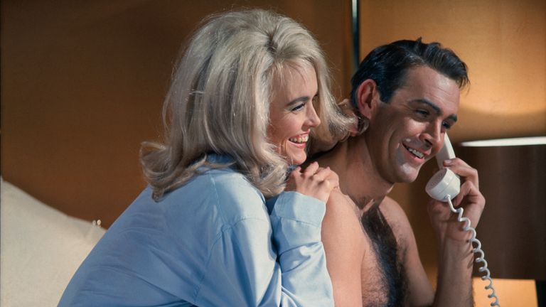 Sean Connery and Jill Masterson
(Original Caption) James Bond (Sean Connery) and Jill Masterson (Shirley Eaton) share a laugh on the phone in the James Bond flick, Goldfinger. 1964.