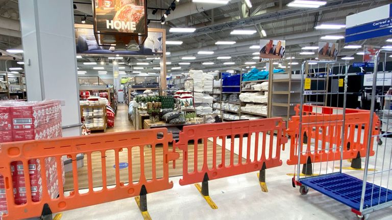 Home products are behind a plastic barrier at a Tesco in Cardiff