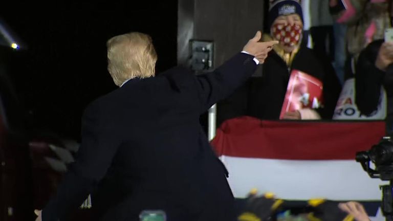 Trump throws a hat into crowd at a rally in Duluth, Minnesota on Sept 30th