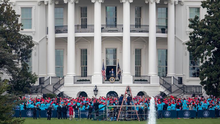 WASHINGTON, DC - OCTOBER 10: U.S. President Donald Trump delivers remarks from the White House balcony to a group of supporters on the South Lawn on October 10, 2020 in Washington, DC. The president is making his first in-person appearance after being cleared by his doctors following his diagnosis of COVID-19 on October 2. (Photo by Tasos Katopodis/Getty Images)
