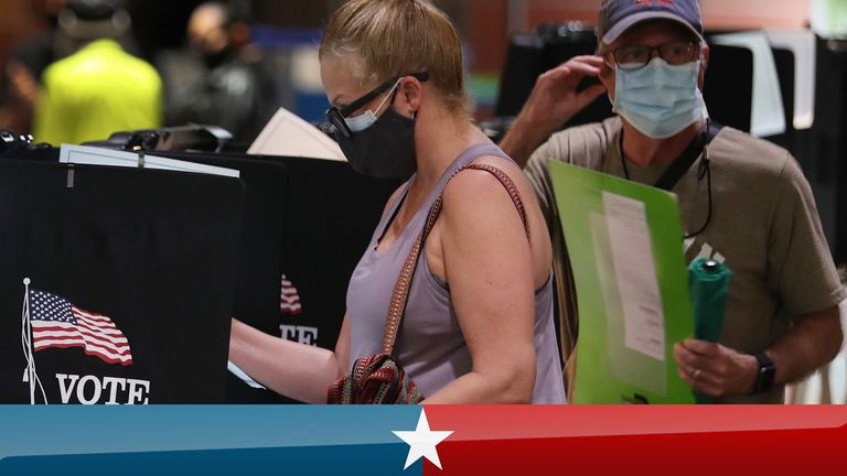 Voters casting early ballots in Florida, one of the states in which voters received emails