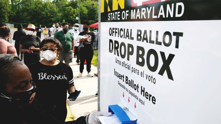 Voters in Maryland can place their ballots into a pavement drop box from their cars to prevent the spread of coronavirus