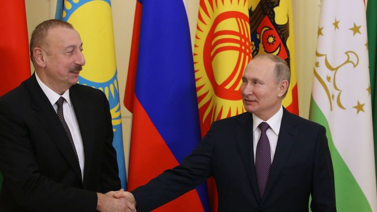 Russian President Vladimir Putin., right, is seen with Azerbaijan's  Ilham Aliyev  in December last year