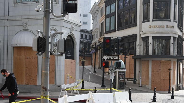 Stores on Rodeo Drive, the world-renowned shopping street in Beverly Hills, California, are bricked up and closed to vehicular and pedestrian traffic on November 3, 2020 as a precaution against potential violence on US Presidential Election Day. Americans voted Tuesday under the shadow of a growing coronavirus pandemic to decide whether to re-elect Republican Donald Trump, one of the most polarized presidents in US history, or send Democrat Joe Biden to the White House.  (Photo by Robyn Beck / AFP) (Photo by ROBYN BECK / AFP via Getty Images)