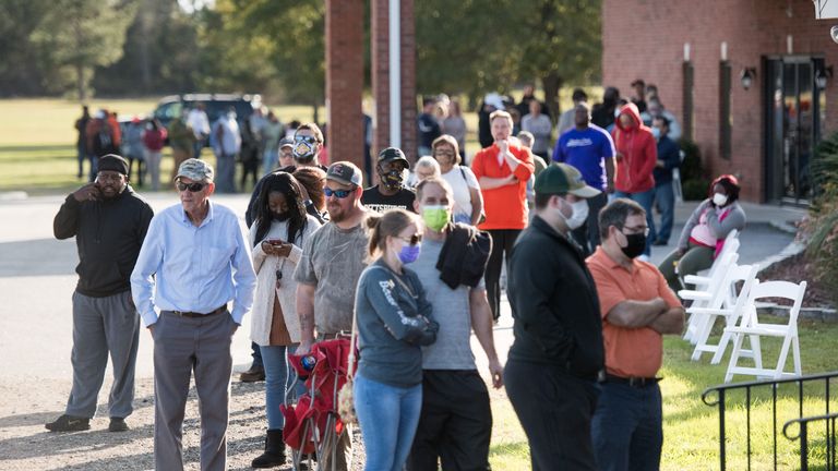 EFFINGHAM, SC - NOVEMBER 03: Voters wait in line to cast their ballot at Savannah Grove Baptist Church on November 3, 2020 in Effingham, South Carolina.  After a record turnout in early voting, Americans head to the polls on the last day to cast their vote for current US President Donald Trump or Democratic nominee Joe Biden in the 2020 presidential election. (Photo by Sean Rayford / Getty Images)