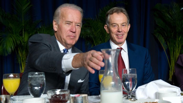 US Vice President Joe Biden reaches for the milk alongside former British Prime Minister Tony Blair during the National Prayer Breakfast at the Washington Hilton in Washington, DC, February 5, 2009. AFP PHOTO / Saul LOEB (Photo credit should read SAUL LOEB/AFP via Getty Images)