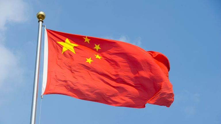 SHANGHAI, CHINA - August 5: The Chinese flag flaps in the wind on August 5, 2010 in Shanghai, China. (Photo by Lucas Schifres/Getty Images)