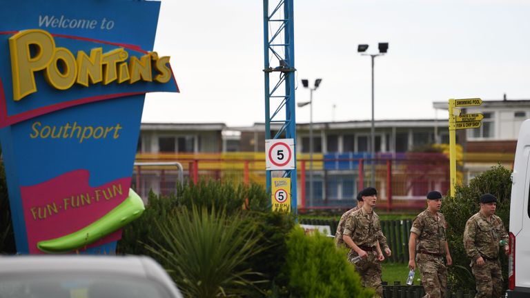Members of the defence forces walk at Pontin's Southport Holiday Park, north of Liverpool on November 5, 2020, prior to assisting in a mass and rapid testing pilot scheme for the novel coronavirus COVID-19 in Liverpool. - Prime Minister Boris Johnson promised "light ahead" for weary Britons ahead of a second coronavirus lockdown, pinning his hopes partly on the UK's first city-wide testing plan in Liverpool, one of the areas worst-hit by the pandemic.

The ambitious pilot scheme in the northwestern city,  in Britain, will start on Friday, a day after all of England is to go into a revised version of the first lockdown instituted in March. (Photo by Oli SCARFF / AFP) (Photo by OLI SCARFF/AFP via Getty Images)