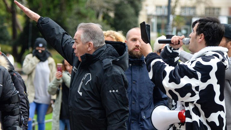 BOURNEMOUTH, ENGLAND - NOVEMBER 21: Anti-blockade protesters gesture to police officers during the march through the city center on November 21, 2020 in Bournemouth, England.  (Photo by Finnbarr Webster / Getty Images)