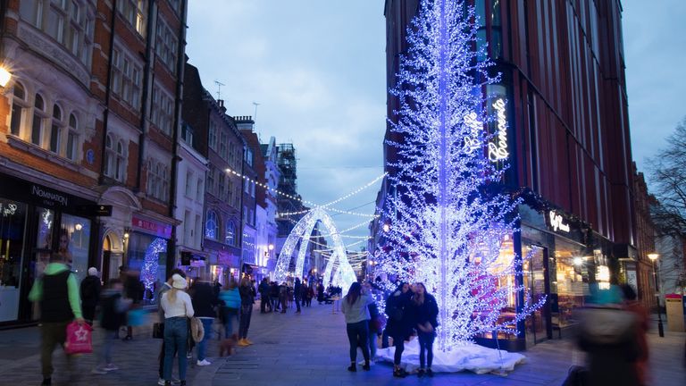 LONDON, ENGLAND - NOVEMBER 21: A view of Blue Arch Christmas Illuminations and busy crowds of people in South Molton Street on November 21, 2020 in London, England. (Photo by Jo Hale/Getty Images)