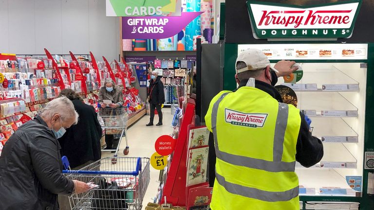 Krispy Kreme donut cabinet in the Tesco Extra store in Wisbech, Cambridgeshire. Cambridgeshire Police officer Simon Read is facing charges of attempting to to buy a 9.95 box of 12 Krispy Kreme donuts for seven pence by sticking a barcode for carrots on them and going through a self-service checkout at the Tesco Extra store.