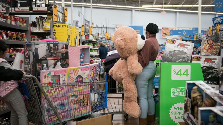 KING OF PRUSSIA, PA - NOVEMBER 28: A woman shops for a stuffed bear in Walmart on Thanksgiving night ahead of Black Friday on November 28, 2019 in King of Prussia, United States. (Photo by Sarah Silbiger/Getty Images)