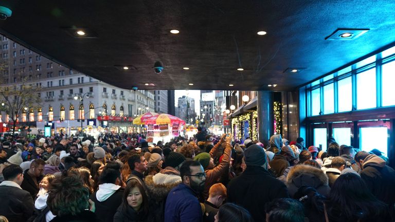 Shoppers wait to enter the Macys department store scheduled to open at 5 p.m. on Thanksgiving for Black Friday specials on November 28, 2019 in New York.  (Photo by Bryan R. Smith / AFP) (Photo by BRYAN R. SMITH / AFP via Getty Images)