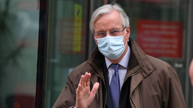 EU chief negotiator Michel Barnier wearing a protective face covering to combat the spread of the coronavirus, waves to members of the media as he leaves a conference centre as negotiations on a trade deal between the EU and the UK continue in London on November 28, 2020. - Britain's chief negotiator David Frost on Friday said a post-Brexit trade deal with the European Union could still be secured, despite a looming deadline and deadlock on key areas. (Photo by DANIEL LEAL-OLIVAS / AFP) (Photo by DANIEL LEAL-OLIVAS/AFP via Getty Images)