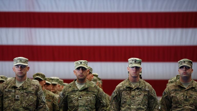 Soldiers from the U.S. Army&#39;s 3rd Brigade Combat Team, 1st Infantry Division, stand at attention while being introduced during a homecoming ceremony in the Natcher Physical Fitness Center on Fort Knox in the early morning hours of Wednesday, November 20, 2013 in Fort Knox, Ky. The 250 soldiers returned to Fort Knox after a nine-month combat deployment working alongside Afghan military and police forces in Afghanistan&#39;s Zabul Province