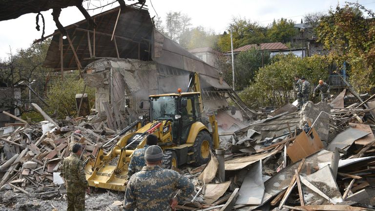 Houses have been destroyed by shelling during the ongoing military conflict 