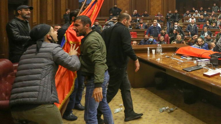 Protesters react inside the parliament, after Armenian Prime Minister Nikol Pashinyan said he had signed an agreement with leaders of Russia and Azerbaijan to end the war on Tuesday, in Yerevan, Armenia November 10, 2020. Vahram Baghdasaryan/Photolure via REUTERS ATTENTION EDITORS - THIS IMAGE HAS BEEN SUPPLIED BY A THIRD PARTY.