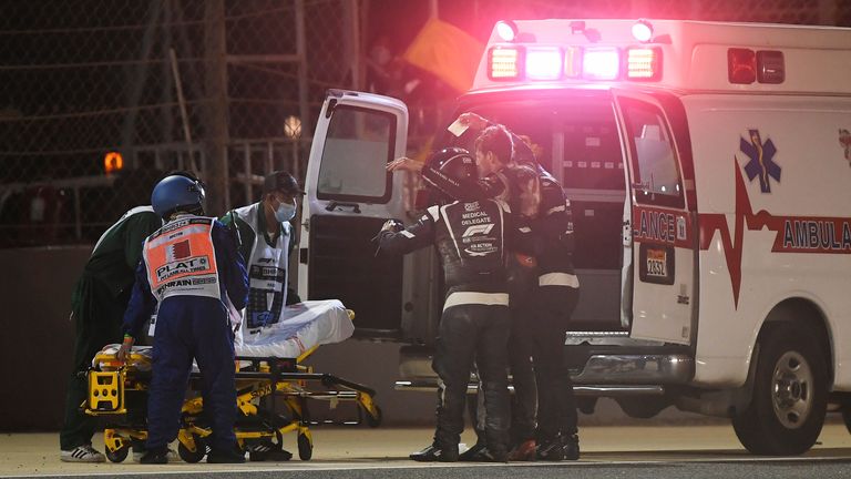 
BAHRAIN, BAHRAIN - NOVEMBER 29: Romain Grosjean of France and Haas F1 is pictured being helped into an ambulance after a crash during the F1 Grand Prix of Bahrain at Bahrain International Circuit on November 29, 2020 in Bahrain, Bahrain. (Photo by Rudy Carezzevoli/Getty Images)

