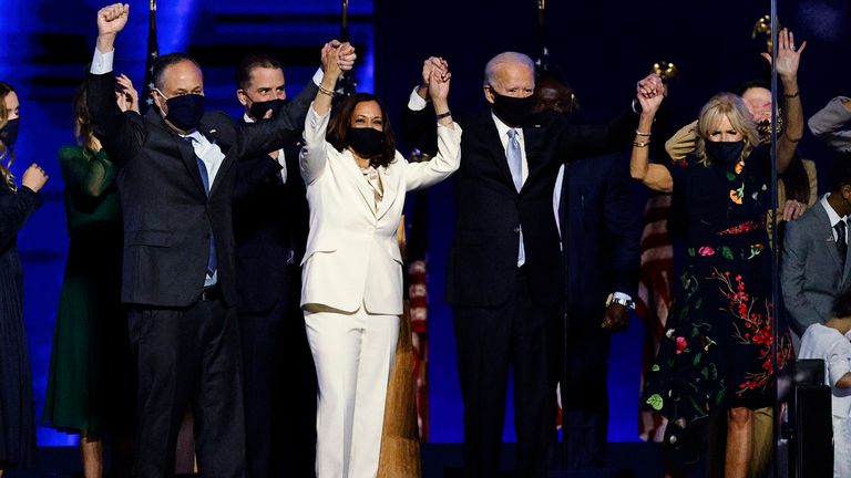 Democratic 2020 U.S. presidential nominee Joe Biden and his wife Jill, and vice presidential nominee Kamala Harris and her husband Doug, celebrate onstage at his election rally, after the news media announced that Biden has won the 2020 U.S. presidential election over President Donald Trump, in Wilmington, Delaware, U.S., November 7, 2020. REUTERS/Jim Bourg