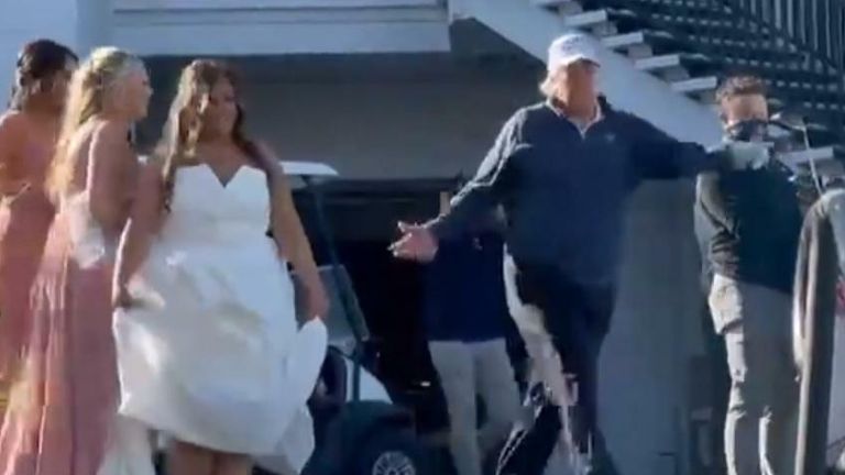 President Trump poses with a bride on a golf course