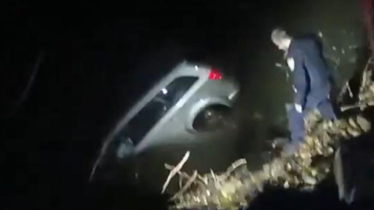 Dramatic rescue of woman from car in frigid river