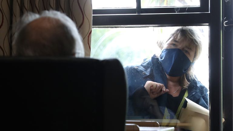 An elderly resident talks to a visitor through the window at nursing home in south London, as research has revealed that care home residents were more likely to die of Covid-19 in the UK than in any of the major European countries apart from Spain. Picture date: Wednesday July 1, 2020.                                         
