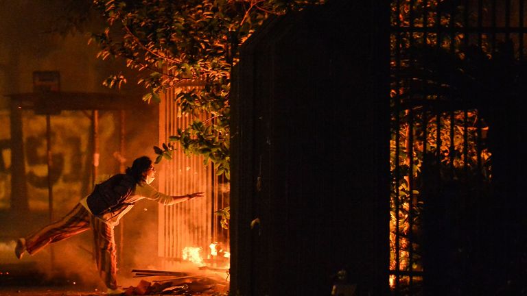 Demonstrators start a fire during a protest at the entrance of a Carrefour supermaket where Joao Alberto Silveira Freitas was beaten to death, in Porto Alegre, Rio Grande do Sul, Brazil, on November 20, 2020