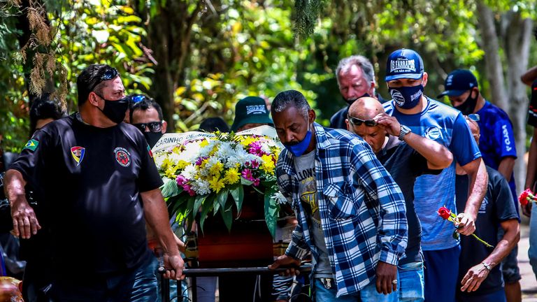 Relatives and friends of Joao Alberto Silveira Freitas, who died after being beaten by white security agents in a supermarket belonging to the Carrefour group, attend his funeral in Porto Alegre, Brazil, on November 21, 2020