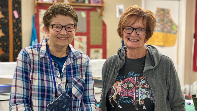 Shop owner Trish Greenwood and cattle rancher Bev Vollmer from North Dakota tell Greg Milam about their objections to COVID restrictions. Nov 2020