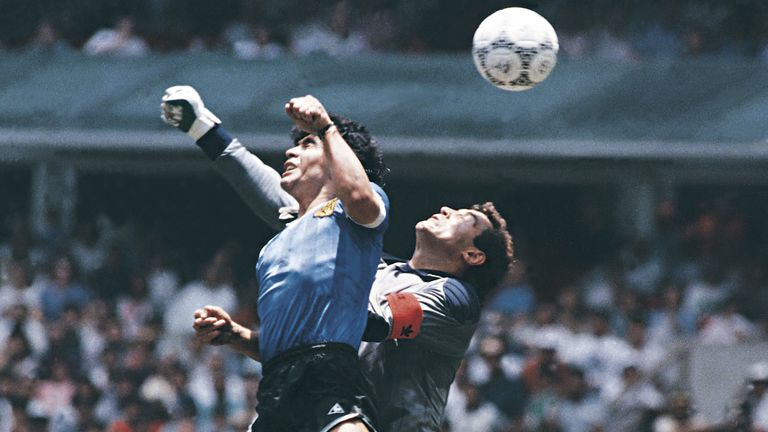 MEXICO CITY, MEXICO - JUNE 22: Diego Maradona of Argentina uses his hand to score the first goal of his team during a 1986 FIFA World Cup Quarter Final match between Argentina and England at Azteca Stadium on June 22, 1986 in Mexico City, Mexico. Maradona later claimed that the goal was scored by &#39;The Hand Of God&#39;. (Photo by Archivo El Grafico/Getty Images)