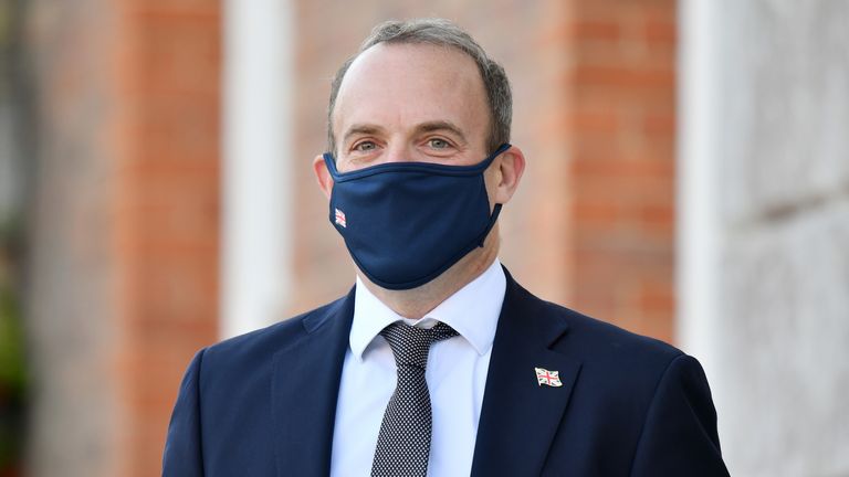 Foreign Secretary Dominic Raab wearing a face mask waits for the French and German foreign ministers to arrive for an E3 Ministers meeting at Chevening House in Sevenoaks, Kent.