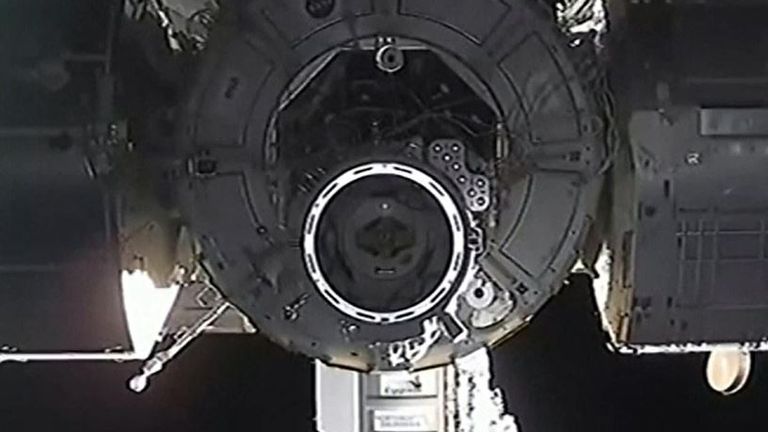Dragon capsule docks with the ISS