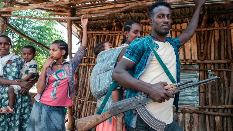 A militia man from Amhara region gets ready to fight alongside government forces in Tigray