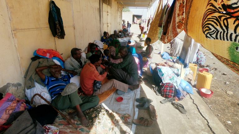 Ethiopians who fled the ongoing fighting in Tigray region sit with their belongings in Hamdait village on the Sudan-Ethiopia border in eastern Kassala state, Sudan November 14, 2020. REUTERS/El Tayeb Siddig