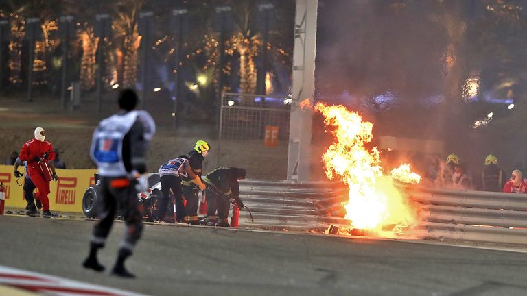 TOPSHOT - Haas F1&#39;s French driver Romain Grosjean&#39;s car burns after crashing during the Bahrain Formula One Grand Prix at the Bahrain International Circuit in the city of Sakhir on November 29, 2020. (Photo by KAMRAN JEBREILI / POOL / AFP) (Photo by KAMRAN JEBREILI/POOL/AFP via Getty Images)
