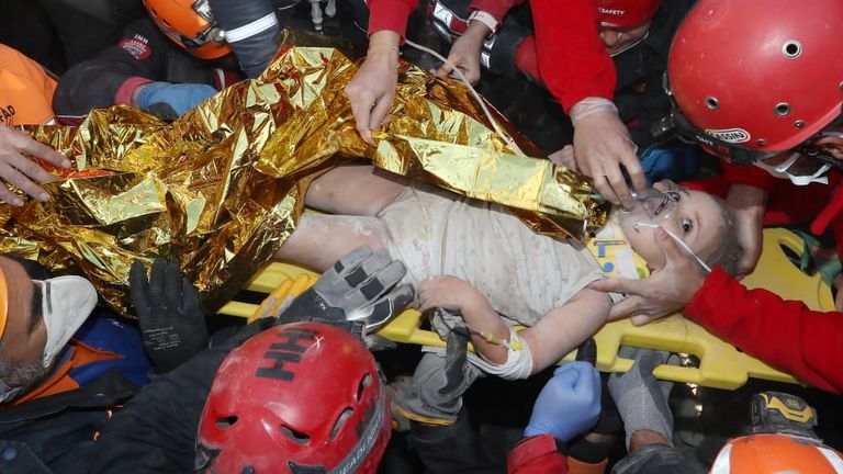 Rescue workers carry a 4-year-old girl, Ayla Gezgin, out from a collapsed building after an earthquake in the Aegean port city of Izmir, Turkey November 3, 2020. Turkey's Disaster and Emergency Management Presidency (AFAD)/Handout via REUTERS ATTENTION EDITORS - THIS PICTURE WAS PROVIDED BY A THIRD PARTY. NO RESALES. NO ARCHIVE.
