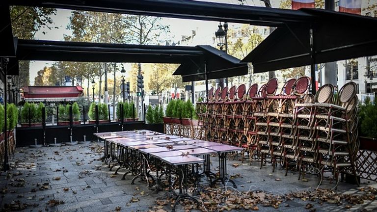 The Champs-Elysees is largely deserted as restaurants and cafes across the country are shut