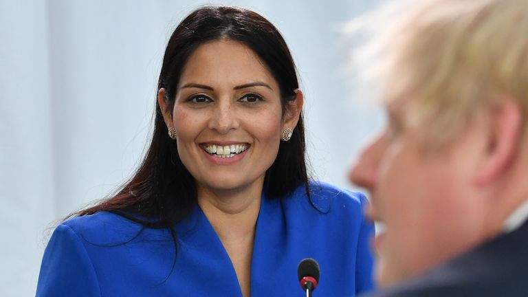 Home Secretary Priti Patel (L) looks on Britain&#39;s Prime Minister Boris Johnson chairs a cabinet meeting at the National Glass Centre at the University of Sunderland on January 31, 2020 