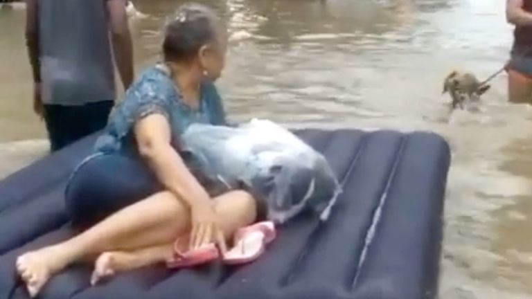 A woman is evacuated on a raft amid floodwaters caused by Hurricane Iota in Cartagena, Colombia. Pic: Luis Guillermo Ferrebus/via Reuters