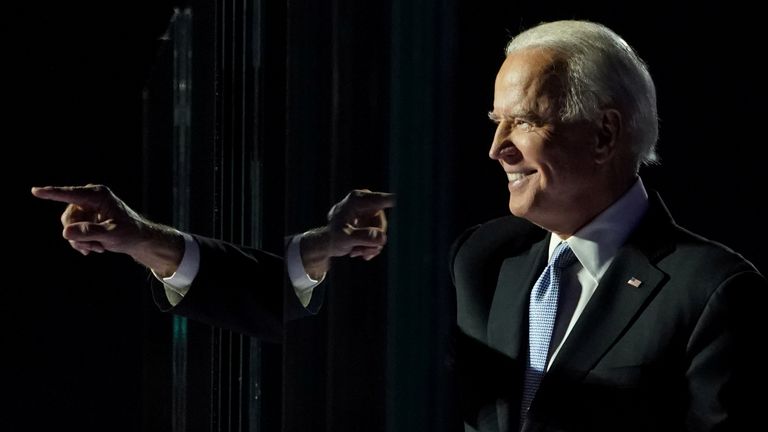President-elect Joe Biden points at his crowd of supporters in Wilmington, Delaware