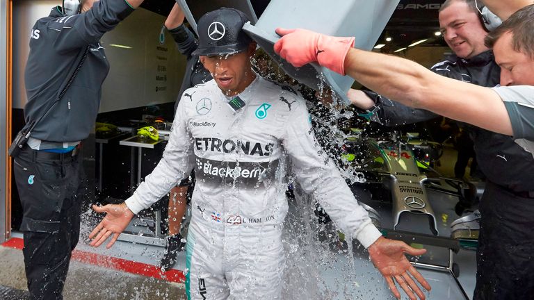 Lewis Hamilton of Great Britain and Mercedes GP takes part in an ice bucket challenge outside the team garage during practice ahead of the Belgian Grand Prix at Circuit de Spa-Francorchamps on August 22, 2014 in Spa, Belgium