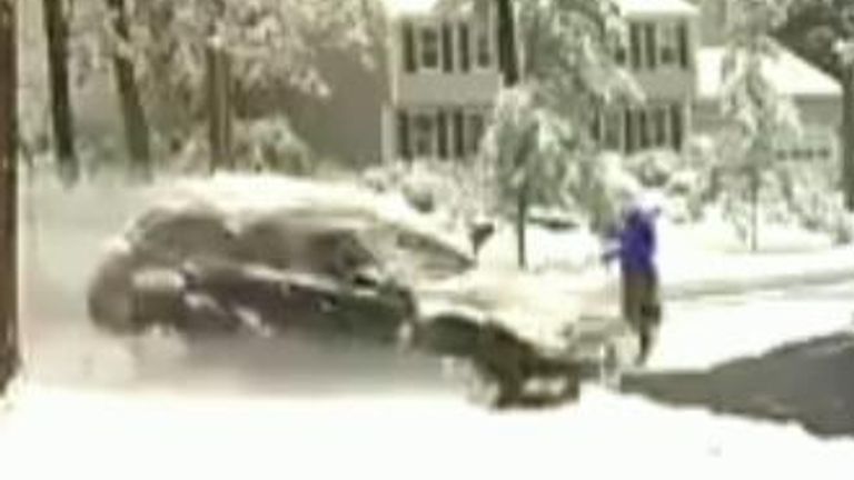 Man Clearing Snow Narrowly Escapes Being Hit by Out-of-Control Car