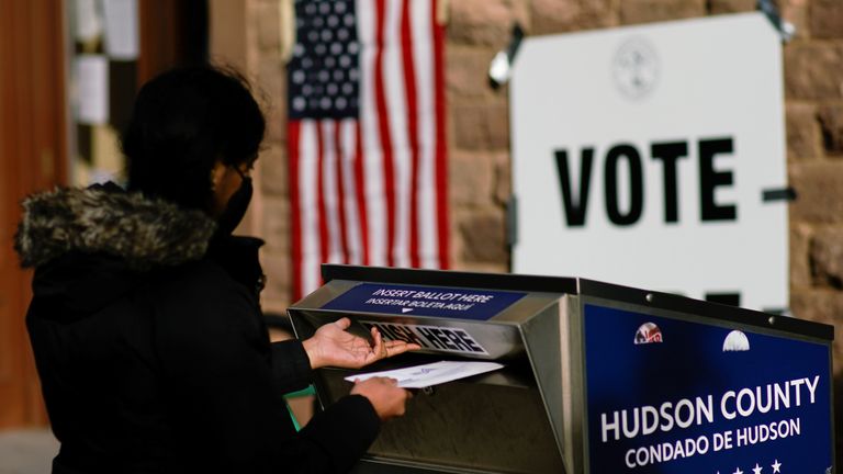 A woman casts her vote in New Jersey, where legalising marijuana was on the ballot