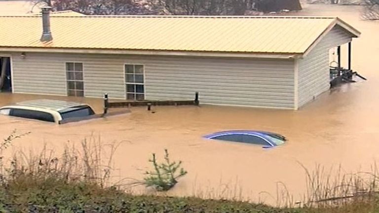 Extreme flooding in North Carolina almost immerses vehicles