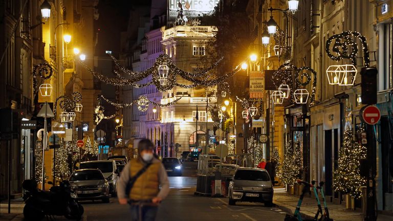 Rue Saint-Honore in Paris is decorated with illuminations for Christmas