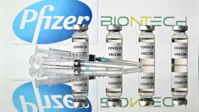 An illustration picture shows vials with Covid-19 Vaccine stickers attached and syringes with the logo of US pharmaceutical company Pfizer and German partner BioNTech, on November 17, 2020. (Photo by JUSTIN TALLIS / AFP) (Photo by JUSTIN TALLIS/AFP via Getty Images)
