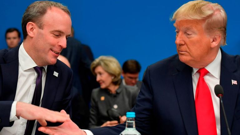 Britain&#39;s Foreign Secretary Dominic Raab (L) shakes hands with US President Donald Trump at the start of the plenary session of the NATO summit at the Grove hotel in Watford, northeast of London on December 4, 2019. (Photo by Tobias SCHWARZ / AFP) (Photo by TOBIAS SCHWARZ/AFP via Getty Images)