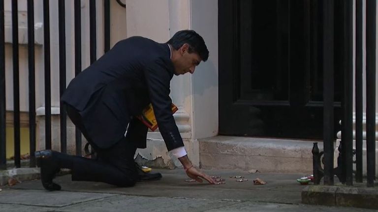 Rishi Sunak lights candles on doorstep of number 11 Downing Street